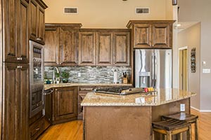 Sollid Cambria Saddle Cabinets & Santa Cecilia Gold Granite